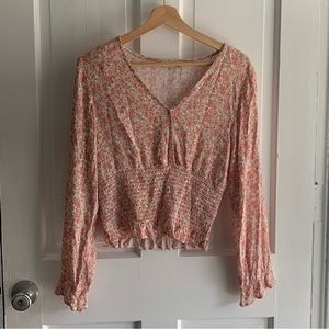 Pink long sleeved blouse